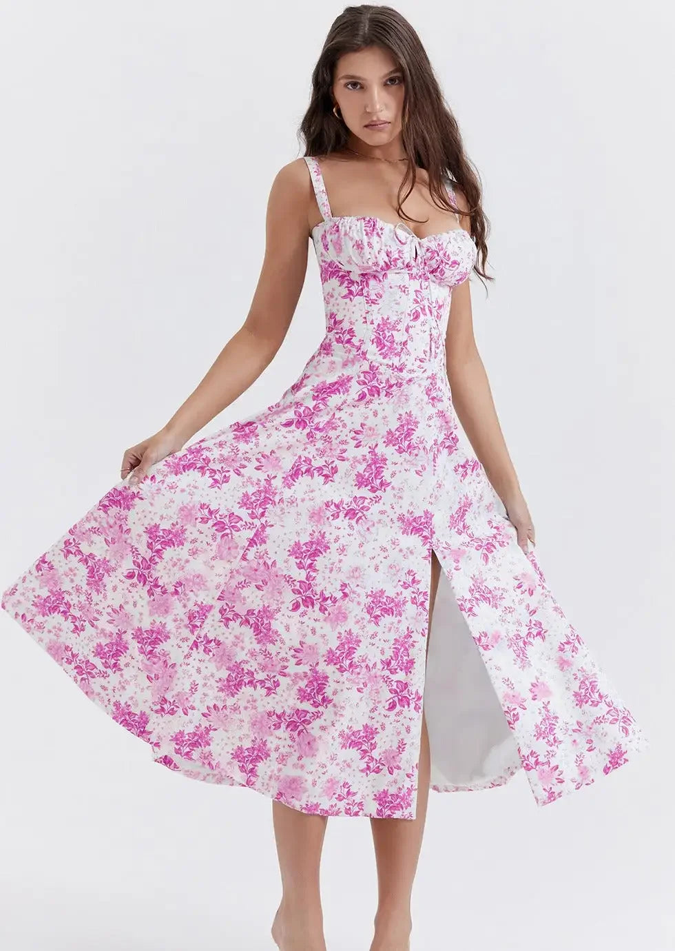 Woman wearing a Mariah Floral Dress by Fashion Images V2 in white and pink floral print.