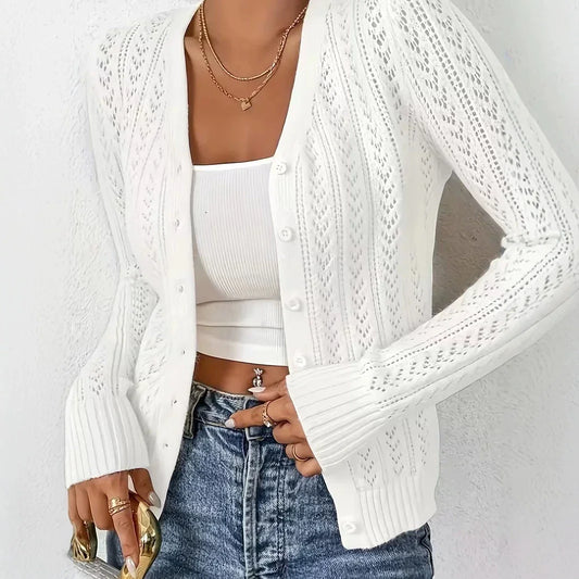 Fashion Images V2 women's white long-sleeve open knit cardigan sweater worn with blue jeans.