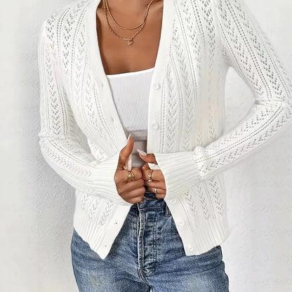 Fashion Images V2 women's white long-sleeve open knit cardigan sweater with gold necklaces.