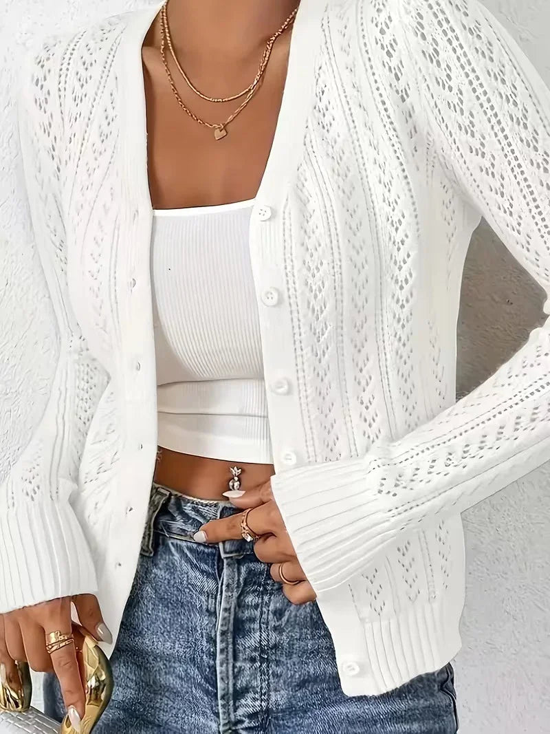 Fashion Images V2 women's white long-sleeve open knit cardigan sweater with gold necklaces.